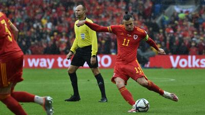 Wales Gareth Bale takes the free-kick which was deflected for the opening goal. AP