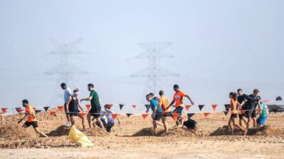People race in the Tough Mudder challenge in Hamdan Sports Complex. All Photos by Reem Mohammed/The National