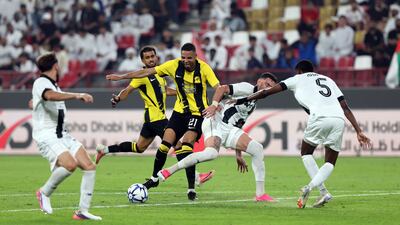 Al Ittihad's Youssef En-Nesyri battles past the Al Jazira defence.