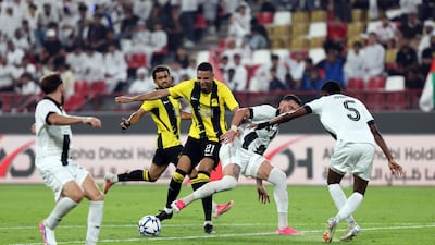 Al Ittihad's Youssef En-Nesyri battles past the Al Jazira defence.