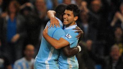 Manchester City’s Sergio Aguero, centre, celebrates with Micah Richards after scoring the fourth goal against Swansea last weekend.