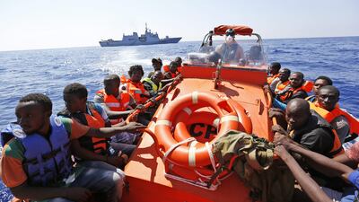 African migrants on board a Norwegian Coast Guard boat in the Mediterranean. Gregorio Borgia / AP