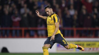 Lucas Perez of Arsenal scores his side’s second goal from the penalty spot. Shaun Botterill / Getty Images