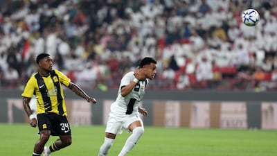 Al Jazira's Bruno, right, heads the ball under pressure from Al Ittihad's Steven Bergwijn.