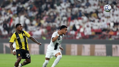 Al Jazira's Bruno, right, heads the ball under pressure from Al Ittihad's Steven Bergwijn.