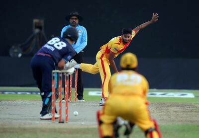 Abu Dhabi's Yodhin Punja bowls during the second season of the Emirates D10 in Sharjah. Chris Whiteoak / The National