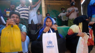 Rohingya refugees at the Kutupalong refugee camp in Cox’s Bazar, Bangladesh. Aid workers are bracing for a possible outbreak of coronavirus in one of the world's largest refugee camps in Bangladesh. Officials warn that containing the disease among more than one million tightly packed Rohingya Muslims will be a daunting task. Suzauddin Rubel / AP