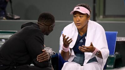 Naomi Osaka talks with her coach Jermaine Jenkins. AP Photo
