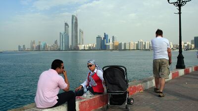 People enjoy the good weather with family and friends at the breakwaters to celebrate the first day of Eid Al Adha in Abu Dhabi. Ravindranath K / The National