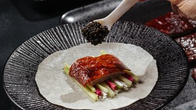 Shi serves black caviar with Peking duck and other dishes.