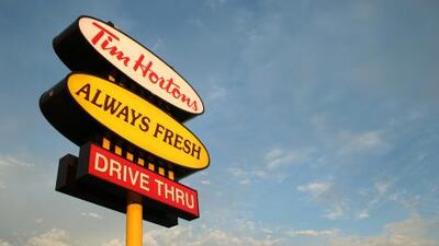 The sun sets on a Tim Hortons coffee shop sign in Cookstown, Ontario. The first Tim Hortons location was opened in 1964 in Hamilton, Ont. and has since grown to Canada's largest coffee shop chain with over 2,200 locations.