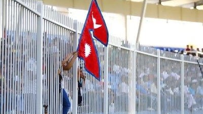 The Nepalese fans cheer on their team in Sharjah yesterday.