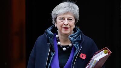 Britain's Prime Minister Theresa May leaves 10 Downing Street in London ahead of the weekly Prime Minister's Questions (PMQs) session in the House of Commons. AFP
