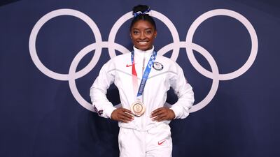 Simone Biles of Team United States poses with the bronze medal following the Women's Balance Beam Final on day eleven of the Tokyo 2020 Olympic Games on August 3, 2021. Getty Images