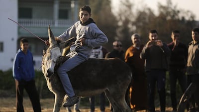 The two perform in front of crowds of gleeful children from their village.