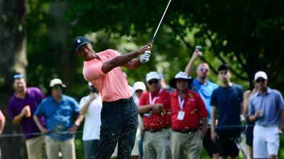 It is the second straight event Tiger Woods has shared the first-round lead after he and Rory McIlroy were tied at the top with 62s in Philadelphia. AP Photo