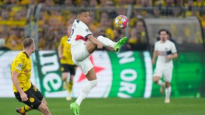 Kylian Mbappe attempts to control the ball in the air. AP