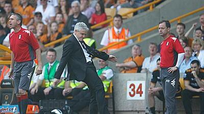 Mark Hughes takes out his frustration after seeing Brede Hangeland booked against Wolves on Saturday by kicking a water bottle. The Fulham manager’s actions would cause him to be sent off and he watched the rest of the game in the stand.