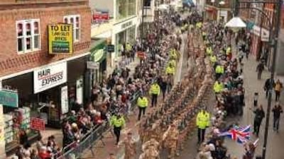 Soldiers from the Royal Anglian Regiment take part in a home coming parade last Wednesday in Watford, England the day after they were heckled by demonstrators when they paraded in Luton.
