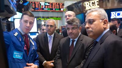 Rashed Al Balooshi, chief executive of the Abu Dhabi Securities Exchange, second right, and other officials from the ADX roadshow take a tour on the floor of the New York Stock Exchange. Dario Cantatore