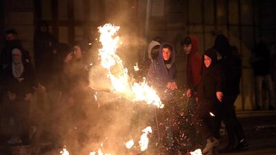 Palestinians build a burning barricade as they clash with Israeli security forces during a protest against US President Donald J. Trump's Middle East peace plan to solve the conflict between Palestinians and Israel, near the West Bank City of Hebron. EPA