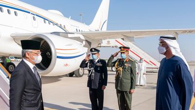 Sheikh Mohamed bin Zayed, Crown Prince of Abu Dhabi and Deputy Supreme Commander of the Armed Forces, receives Sultan Abdullah Sultan Ahmad Shah, King of Malaysia, at the Presidential Airport. Mohamed Al Hammadi / Ministry of Presidential Affairs