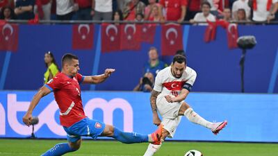 Hakan Calhanoglu of Turkey scores his team's opening goal during the Euro 2024 group stage match against Czech Republic in Hamburg. Getty Images