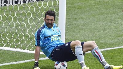 Italy’s goalkeeper Gianluigi Buffon sits on a ball as he warms up before the Euro 2016 group E football match between Italy and Sweden at the Stadium Municipal in Toulouse on June 17, 2016. Pascal Pavani / AFP