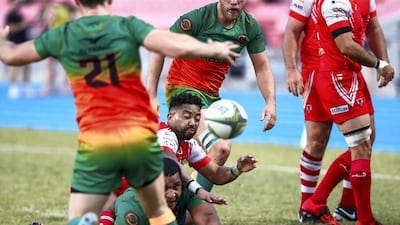 Lukhanye Sonbinq of the Dubai Tigers attempts an offload.