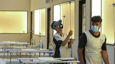 Iraqi volunteers with the Aqiq Institution for Charity work on building a 525-bed field hospital at the Baghdad International Fair exhibition centre in the capital Baghdad. AFP