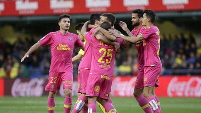 Las Palmas' players jubilate a goal against Villarreal during their Primera Division soccer match played at El Madrigal stadium in Villareal, Castellon, Spain on 05 March 2016. EPA/DOMENECH CASTELLO