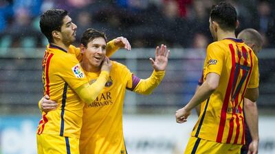 Lionel Messi, centre, celebrates with Barcelona teammates after scoring the third goal in the 4-0 win at Eibar. Juan Manuel Serrano Arce / Getty Images
