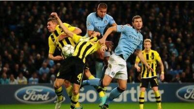 Lukasz Piszczek, left, and his Borussia Dortmund teammates were unlucky to leave Manchester with only a point off a 1-1 draw against City in their Champions League match.