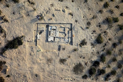 An aerial shot from 2009 showing the church at the Sir Bani Yas monastery. Now more ruins have been unearthed and an awning covers the site. Abu Dhabi Tourism Development and Investment Company / AFP