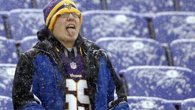 A Minnesota Vikings fan captures snowflakes on his tongue in Baltimore. Patrick Semansky / AP