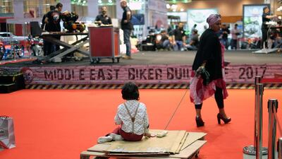 Visitors at the International Motor Show Abu Dhabi and Custom Show Emirates at Abu Dhabi National Exhibition Centre. Delores Johnson / The National