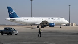 A Syrian Air aircraft sits on the tarmac at Damascus International Airport. AFP