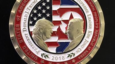 The original commemorative coin designed by the White House Communications Agency. EPA / STR