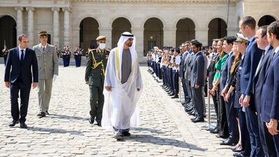 Sheikh Mohamed is accompanied by Mr Le Cornu as he inspects a guard of honour and meets officials at the military museum. Photo: Presidential Court