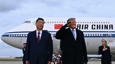 US President Donald Trump, right, with Chinese President Xi Jinping at Joint Base Andrews in Maryland. Mr XI is on an official visit to the US. AFP