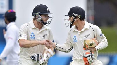 New Zealand's Kane Williamson, left, shakes hands with partner BJ Watling after their record sixth-wicket partnership on Tuesday to lead New Zealand to declare at 524. Marty Melville / AFP / January 6, 2015
