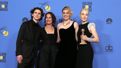 Saoirse Ronan holds the award for Best Performance by an Actress in a Motion Picture Musical or Comedy in Lady Bird with Timothy Chalamet Laurie Metcalf, and Greta Gerwig. EPA