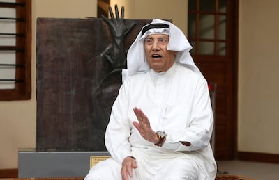 Kuwaiti sculptor Sami Mohammed poses in front of one of his works at the Museum of Modern Art in Kuwait City. AFP