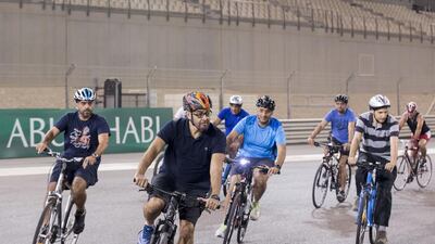The Crown Prince of Abu Dhabi, and Sheikh Hamed bin Zayed Chairman of Crown Prince Court — Abu Dhabi and Executive Council Member, left, riding their bicycles around Yas Marina Circuit during the weekly TrainYAS event in October. Ryan Carter / Crown Prince Court — Abu Dhabi