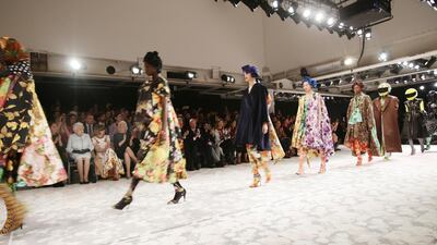 The monarch viewed Richard Quinn's runway show before presenting him with the inaugural Queen Elizabeth II Award for British Design. Getty
