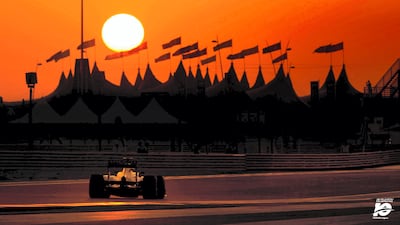 Looking for all the world like a scene from a David Lean blockbuster movie, silhouettes of Bedouin tents stand in front of a perfect bright yellow setting sun providing a stunning backdrop to the Mercedes of Lewis Hamilton as he races towards this wonderful vista during the 2013 Abu Dhabi Grand Prix.