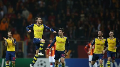 Arsenal's Aaron Ramsey celebrates with teammates after scoring one of his two goals against Galatasaray in his team's 4-1 Champions League win on Tuesday. Emrah Gurel / AP / December 9, 2014