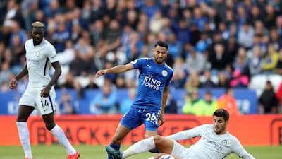 Alvaro Morata puts in a slide tackle on Riyad Mahrez. Clive Mason / Getty Images