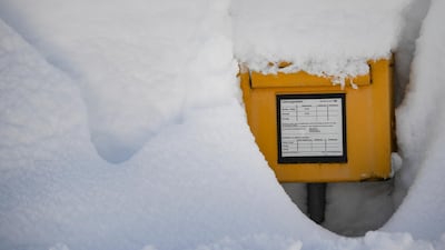 A letterbox is covered by heavy snow in Gerold. EPA