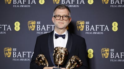 Director Paul Thomas Anderson with the awards for Best Film, Best Adapted Screenplay and Best Director, won for One Battle After Another. EPA
